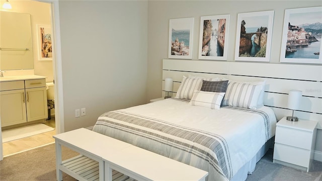 13706 Werrington Dr, Winter Garden, FL 34787 - bedroom featuring a sink, connected bathroom, and light colored carpet