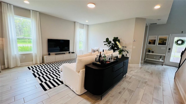 13706 Werrington Dr, Winter Garden, FL 34787 - living area with baseboards, light wood-type flooring, visible vents, and recessed lighting