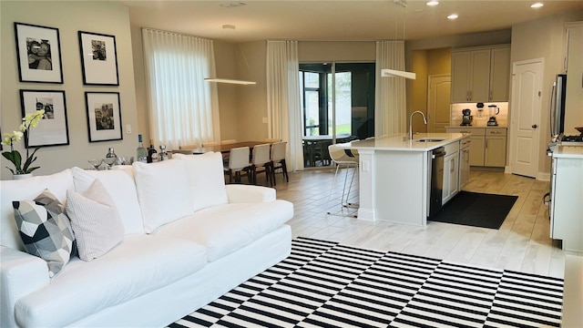 13706 Werrington Dr, Winter Garden, FL 34787 - living room featuring light wood-style flooring and recessed lighting