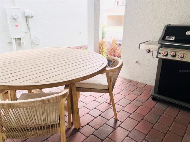 balcony with a patio and grilling area