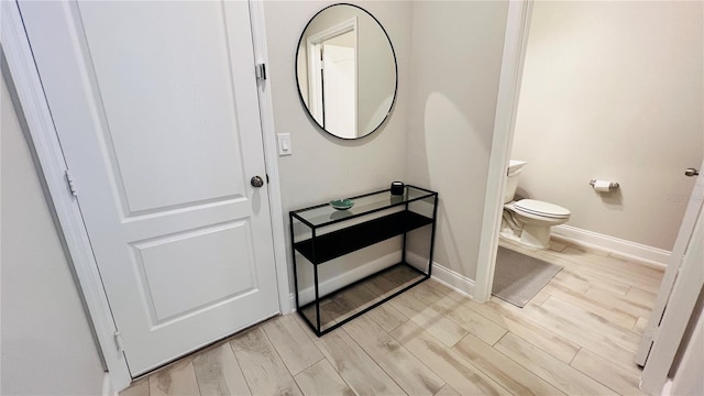13706 Werrington Dr, Winter Garden, FL 34787 - half bathroom with toilet, wood finish floors, and baseboards