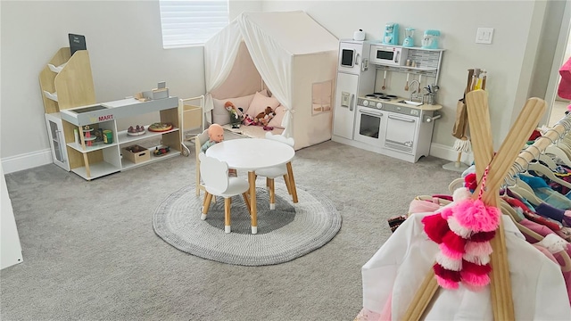 game room with light colored carpet