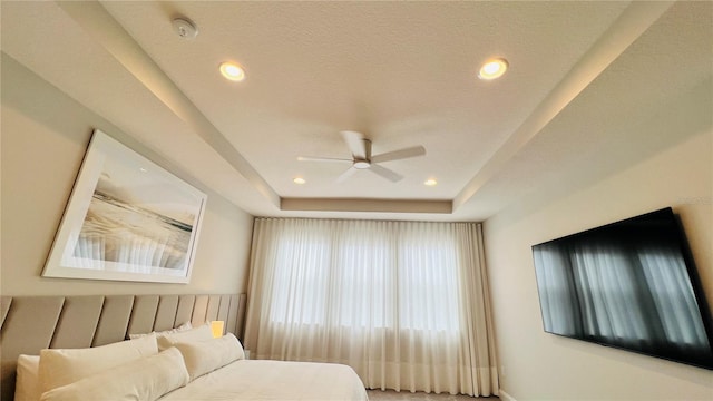 13706 Werrington Dr, Winter Garden, FL 34787 - bedroom with a tray ceiling, a ceiling fan, recessed lighting, and a textured ceiling