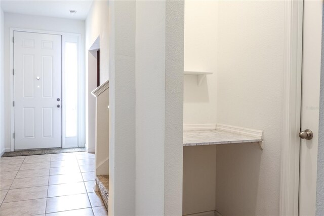 interior space featuring light tile patterned flooring