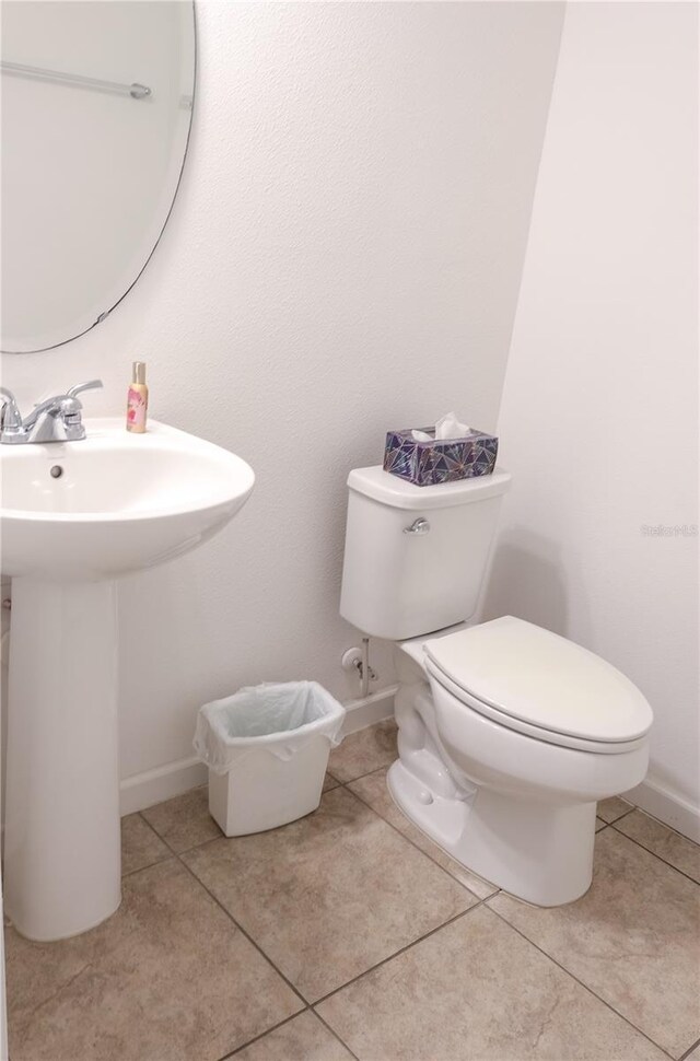 bathroom featuring tile patterned flooring and toilet