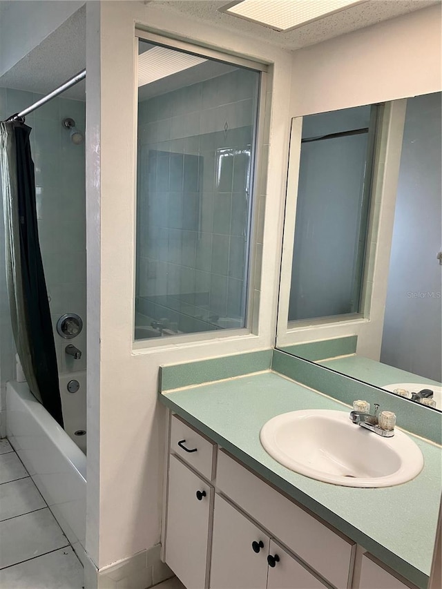 bathroom with tile patterned floors, vanity, and shower / tub combo with curtain