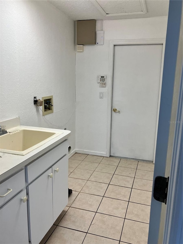 bathroom with tile patterned flooring and vanity