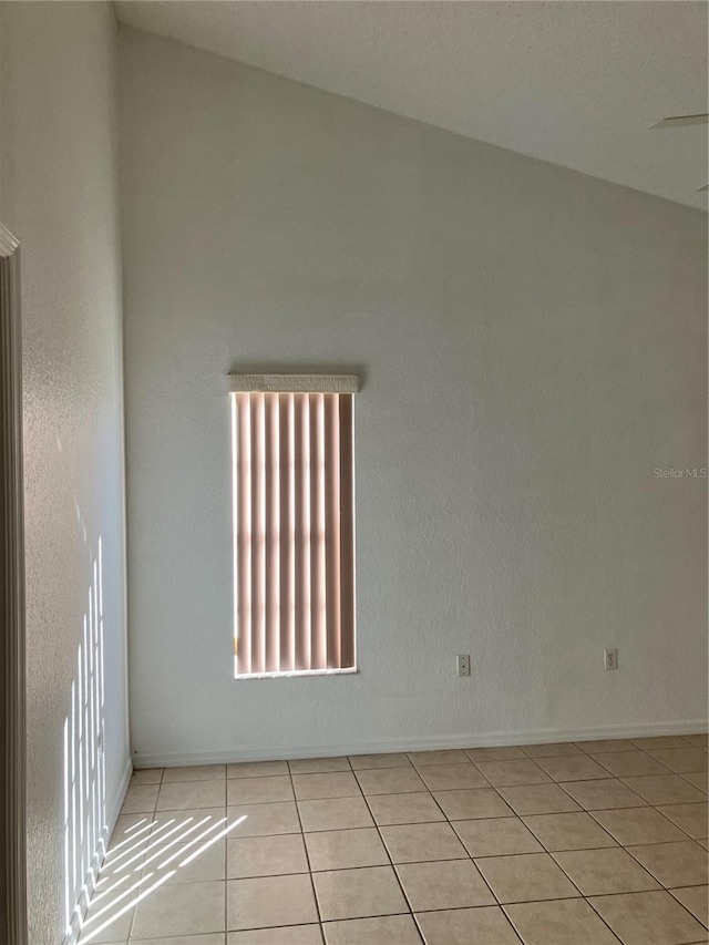 spare room featuring light tile patterned floors