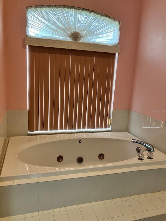 bathroom featuring a relaxing tiled tub