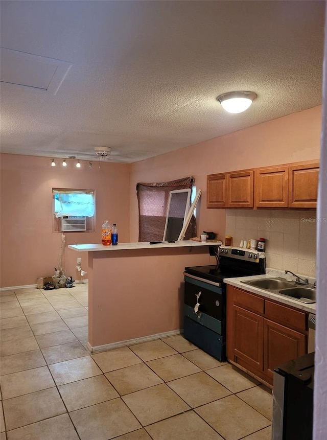 kitchen with a textured ceiling, black electric range, cooling unit, light tile patterned floors, and sink