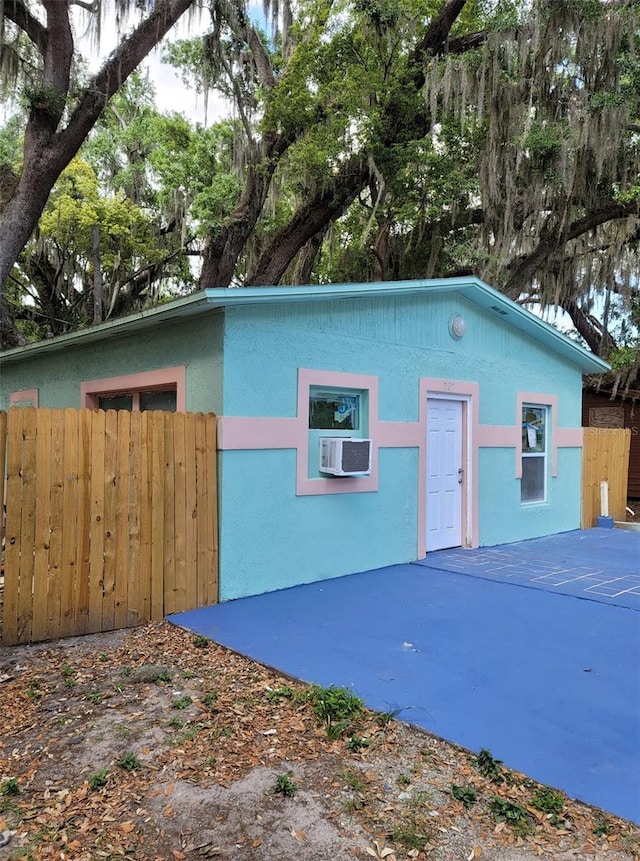 view of front of house with cooling unit