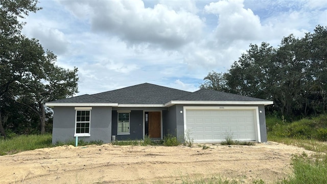 single story home with a garage