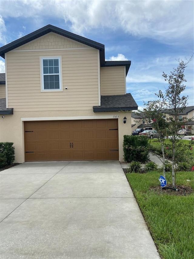 view of property exterior with a garage