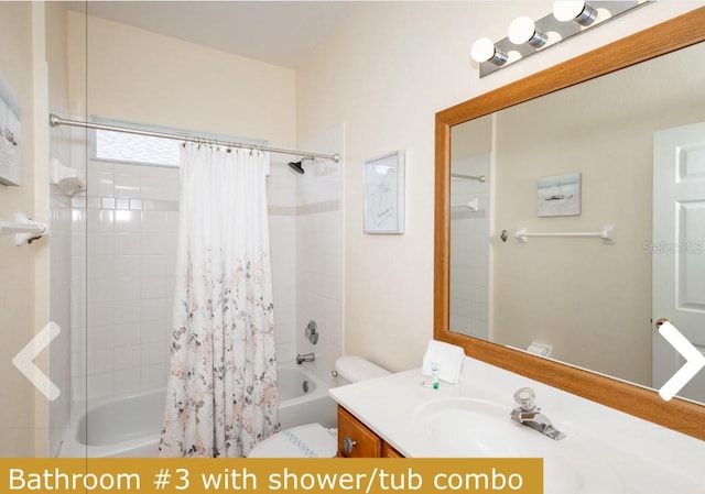 full bathroom featuring vanity, shower / bathtub combination with curtain, and toilet