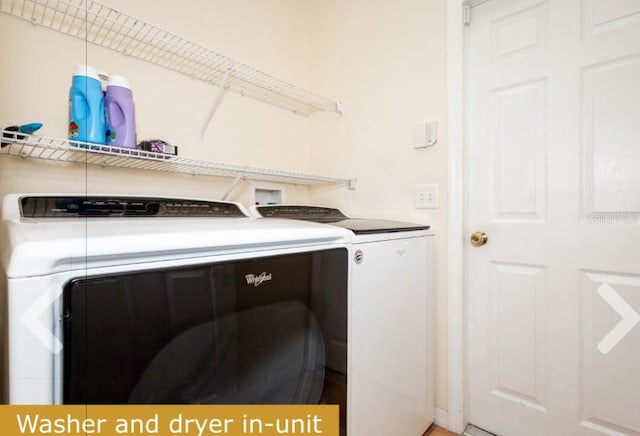 laundry area with washing machine and dryer