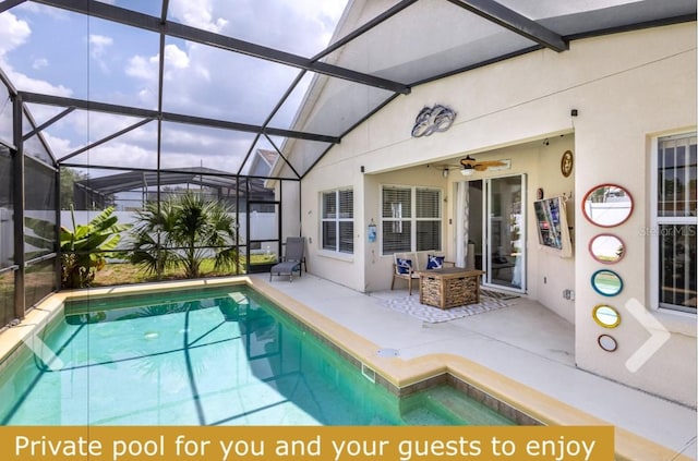 view of swimming pool with a lanai, a patio, and ceiling fan