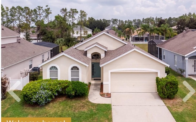 view of front of house featuring a front lawn and a garage