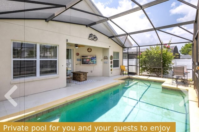 view of swimming pool with a patio area and a lanai