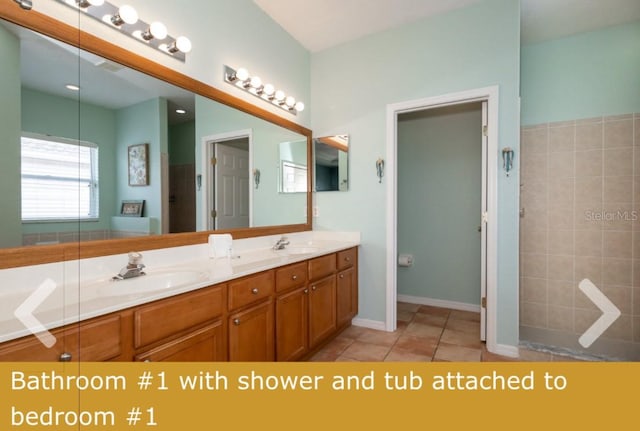 bathroom with vanity and tile patterned flooring