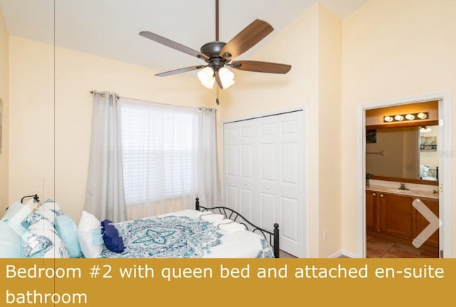 tiled bedroom with a closet, ensuite bath, sink, and ceiling fan