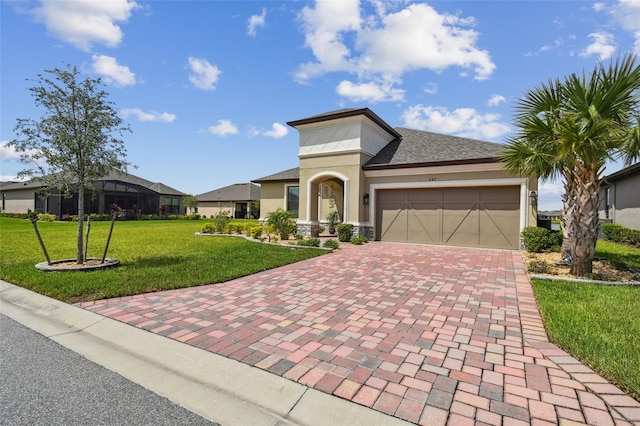 view of front of house with a front yard and a garage