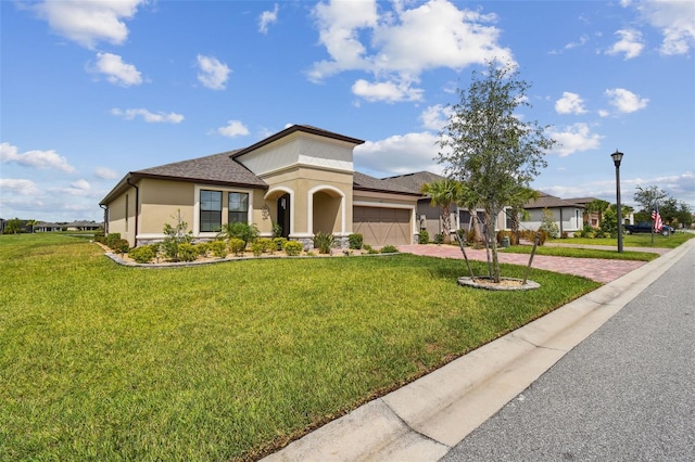 view of front of property featuring a garage and a front yard