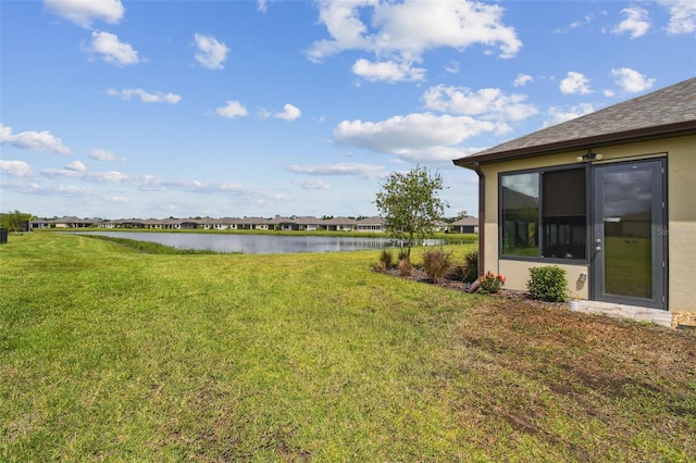 view of yard with a water view