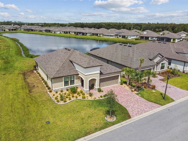 exterior space featuring a front yard and a water view