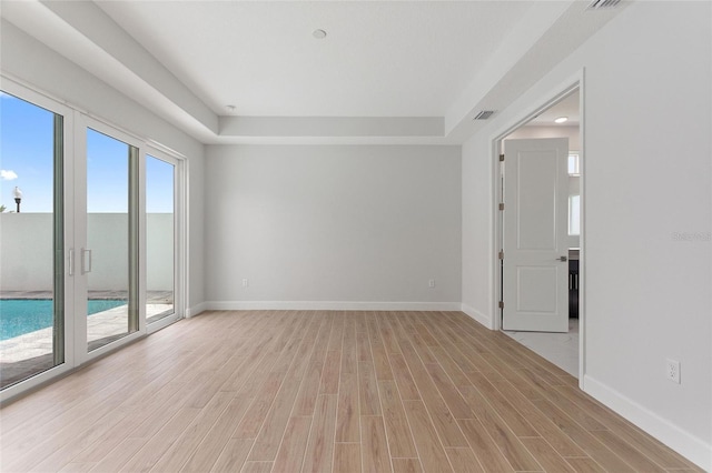 spare room featuring light hardwood / wood-style flooring