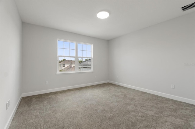 empty room featuring carpet flooring