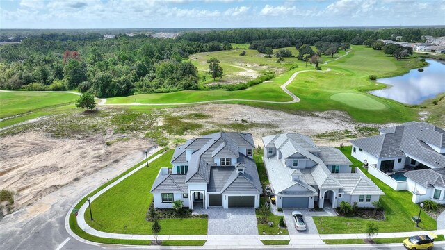 107 Hampton Loop, Davenport, FL 33837 - aerial view of residential area with a golf course and a large body of water