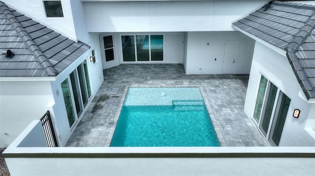 107 Hampton Loop, Davenport, FL 33837 - swimming pool featuring a patio