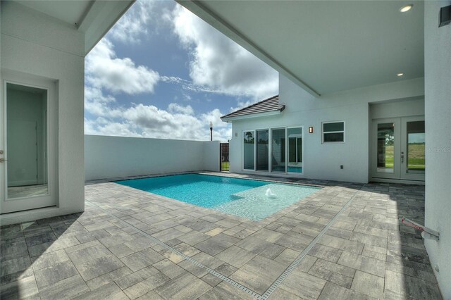 107 Hampton Loop, Davenport, FL 33837 - view of pool with french doors and a patio area