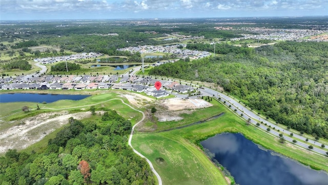107 Hampton Loop, Davenport, FL 33837 - aerial overview of property's location featuring a large body of water, nearby suburban area, a golf club, and a heavily wooded area