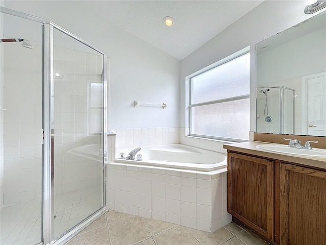 full bath featuring a shower stall, tile patterned floors, lofted ceiling, a bath, and a textured ceiling