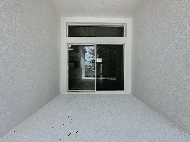 property entrance with stucco siding