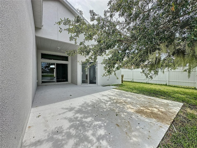 view of patio / terrace featuring fence