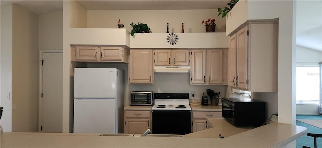 kitchen with white appliances and light brown cabinets