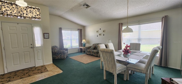 carpeted dining room featuring lofted ceiling and a textured ceiling