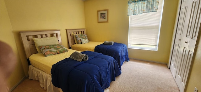 carpeted bedroom featuring a closet