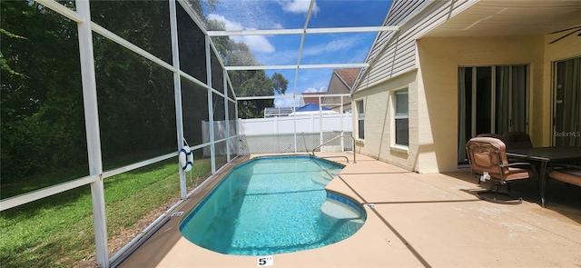 view of pool featuring a lanai and a patio area