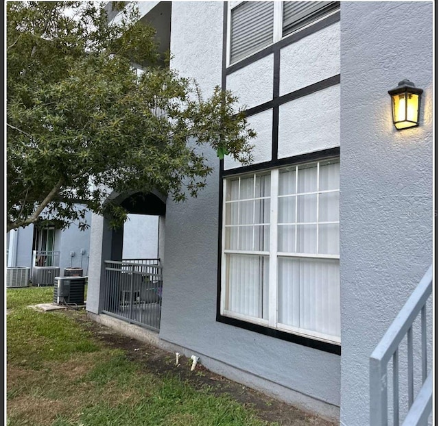 view of side of home with cooling unit