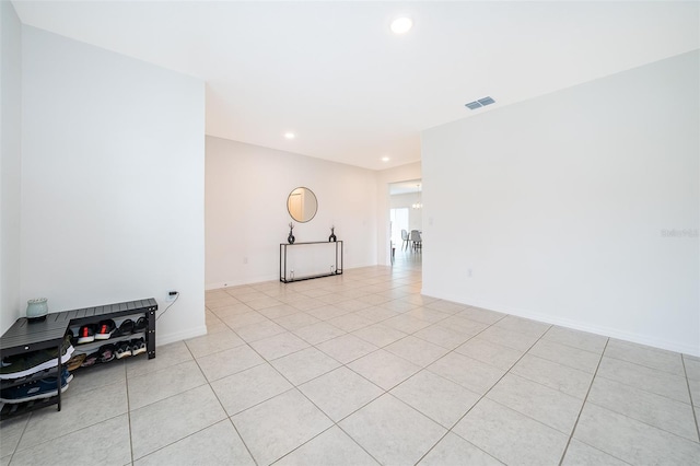 unfurnished room featuring light tile patterned flooring