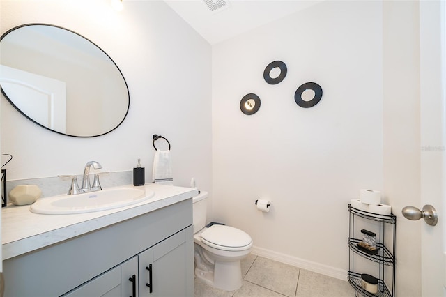 bathroom featuring vanity, toilet, vaulted ceiling, and tile patterned flooring