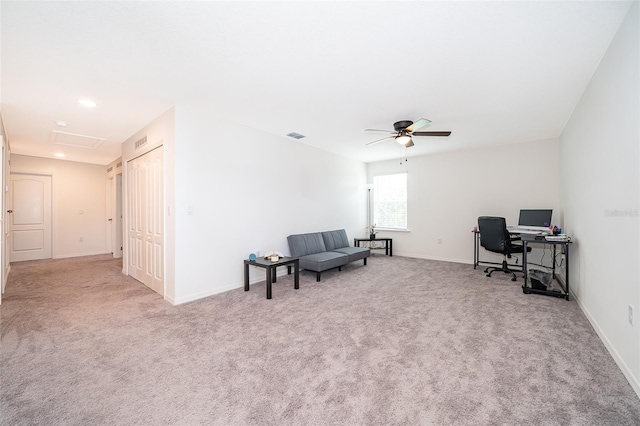 home office with ceiling fan and light colored carpet