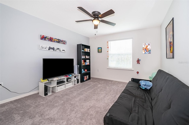 carpeted living room featuring ceiling fan