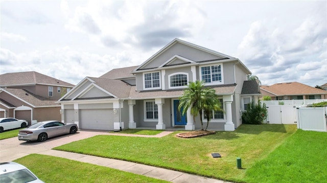 front of property with a garage and a front lawn