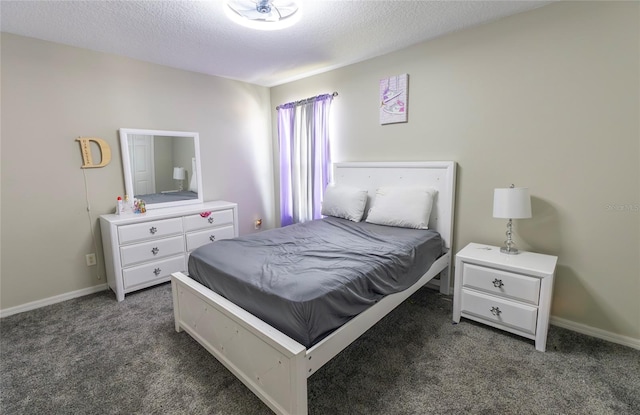 carpeted bedroom with a textured ceiling