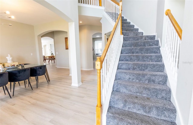 staircase featuring hardwood / wood-style floors