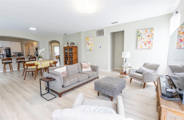 living room with light hardwood / wood-style floors